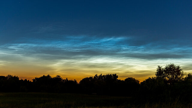 NLC (noctilucent clouds). Night shining clouds in the twilight