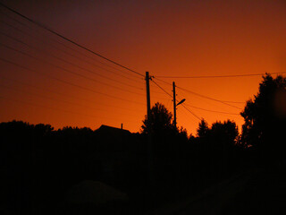 Rural silhouettes in dusk sky