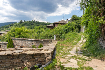 Fototapeta na wymiar Old houses at Village of Kovachevitsa, Bulgaria