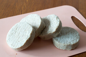 frozen cutlets (semi-finished product) on cutting board