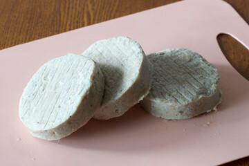 frozen cutlets (semi-finished product) on cutting board