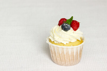 Vanilla Cupcake with Fresh Berries. Light dessert.