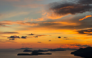 Fototapeta na wymiar Sunset Islands and Sky Clouds, Orange color, Adriatic Sea Sun Setting in Dubrovnik, Croatia