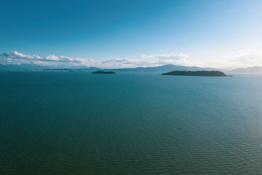 Brazil, Florianopolis. Panoramic aerial view of Daniela beach pontal peninsula and river from far away. 