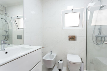 Modern stylish bathroom in the house, hotel, in white colors. Conceptual photo.