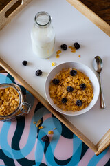 Healthy breakfast cereals, blueberries and milk