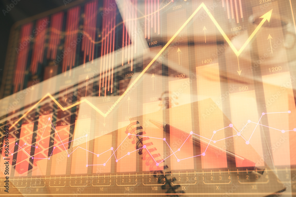Poster Double exposure of financial chart drawing and desktop with coffee and items on table background. Concept of forex market trading