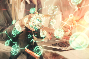 Double exposure of man and woman working together and social network theme hologram drawing. People connection concept. Computer background.
