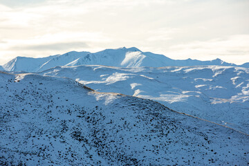 Panorama of Snow Mountain Range Landscape with Blue Sky background from New Zealand.