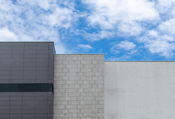wall exterior facade modern architecture bright and dark gray color simple background object with outdoor view on blue sky white cloud