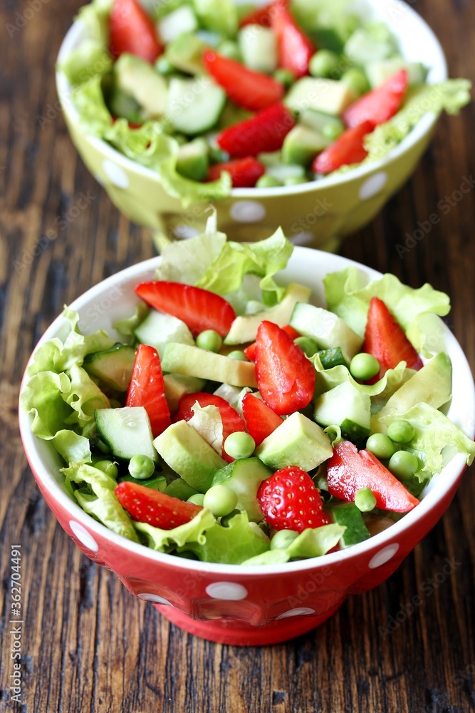 Canvas Prints summer salad with strawberries, avocado,   green peas. copy space