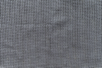 Gray eco shopping bag texture background. Plastic free and zero waste concept. Top view, close up