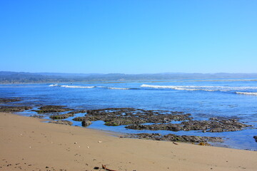 Fototapeta na wymiar California Pacific Coastal scenery of the ocean low tide with rocks 
