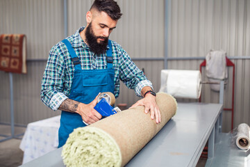 Professional worker doing his job at carpet washing service.
