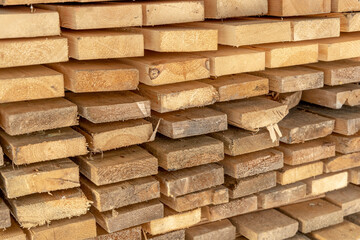 Wooden boards in stack. Construction material. Close-up