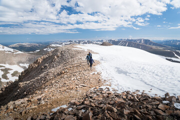 Fototapeta premium Hikers at the summit of a peak in Colorado. 
