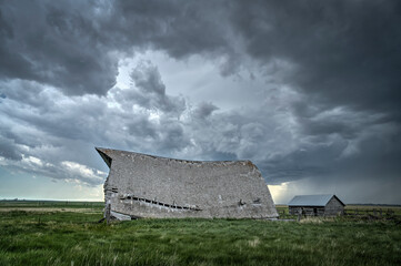 Abandoned farmstead structures on the Great  Plains with Dramatic Skies Overhead