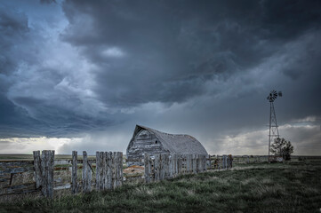 Abandoned farmstead structures on the Great  Plains with Dramatic Skies Overhead