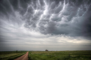 Abandoned farmstead structures on the Great  Plains with Dramatic Skies Overhead