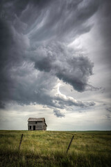 Abandoned farmstead structures on the Great  Plains with Dramatic Skies Overhead