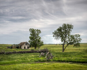 Abandoned farmstead structures on the Great  Plains with Dramatic Skies Overhead