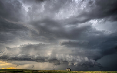 Abandoned farmstead structures on the Great  Plains with Dramatic Skies Overhead