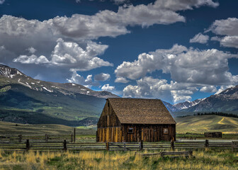 Fototapeta na wymiar An old rustic farmstead on the western side of the Rocky Mountains
