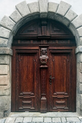 Fototapeta na wymiar Old wooden door of Cesky Krumlov, Czech Republic..