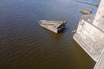 Walk on a sightseeing boat on the Vltava River past Charles Bridge in Prague, Czech Republic