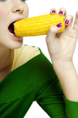 Woman eating corn