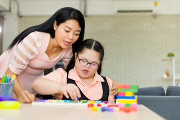 Autism girl with learning practice at home.