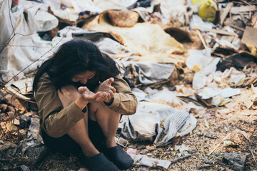 poor people,homeless or beggar begging for help sitting at dirty slum.concept for poverty...