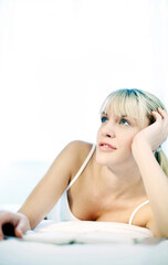 Fototapeta premium Woman daydreaming on the bed