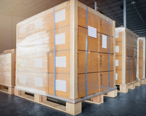 Large shipment boxes wrapping plastic on pallets at warehouse storage. Warehouse cargo industry delivery goods. Manufacturing warehouse shipping logistics and transport