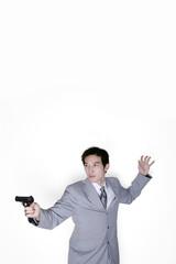 Businessman aiming his pistol