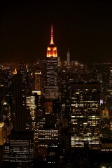 Fototapeta na wymiar Illuminated Buildings In City At Night