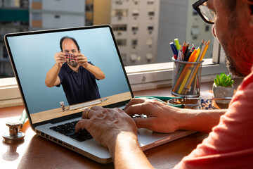 doctor talks to his patient via telemedicine during the coronavirus pandemic at his front-to-window residence