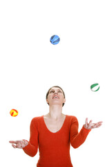 Woman juggling with three balls