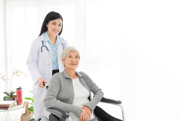 Asian health worker drive a wheelchair of old patient, doctor and old female talk about disease symptoms, happy hospital, rehabilitation activity, elderly healthcare promotion