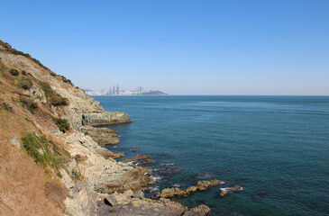 Fototapeta na wymiar View of Igidae park coastline and Haeundae district from Oryukdo Skywalk in sunny day, Busan, South Korea
