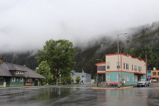 Rainy downtown Seward Alaska with a mountain and low lying clouds