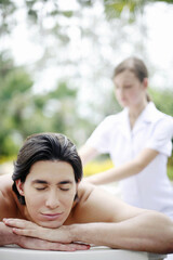Obraz na płótnie Canvas Man enjoying a body massage