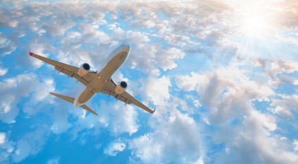 White passenger airplane in the clouds  - Travel by air transport