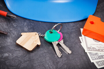 Home keys, currencies dollar and work tools using for engineering work. Building home concept