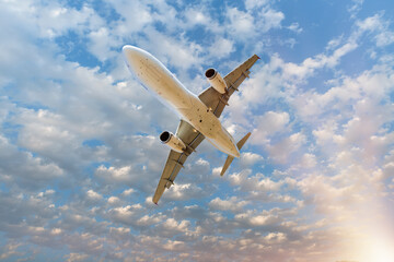 White passenger airplane in the clouds  - Travel by air transport