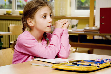 Girl daydreaming in the classroom