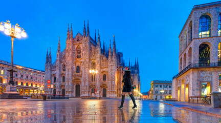 Duomo di Milano (Milan Cathedral) and Piazza del Duomo in the Morning, Milan, Italy - Woman in black clothes walking on the street