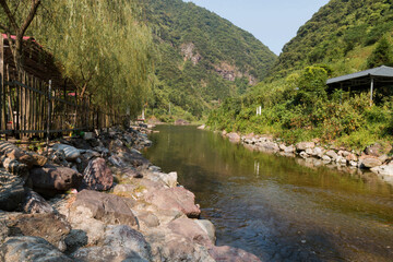 Fototapeta na wymiar A small river that flows through a valley