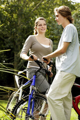 Young man and woman on cycling excursion