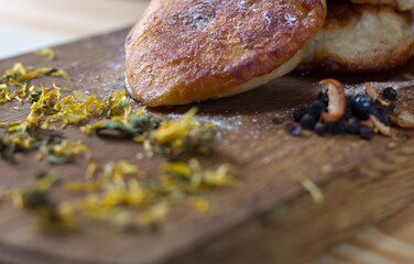 Close-up of fritters with dried blueberries on a wooden table